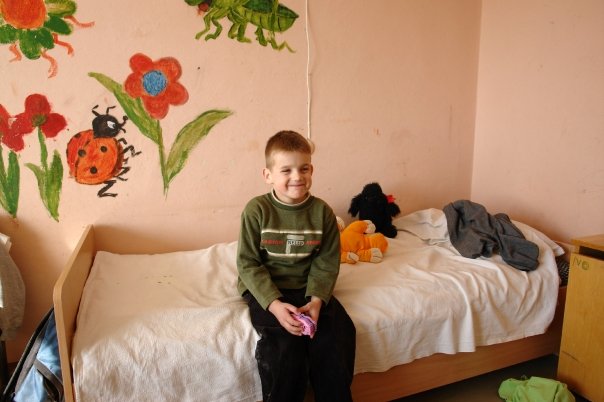 SimpleTech founder Armands as a child in the orphanage where he grew up in Latvia — the story behind our mission to feed Pomona families